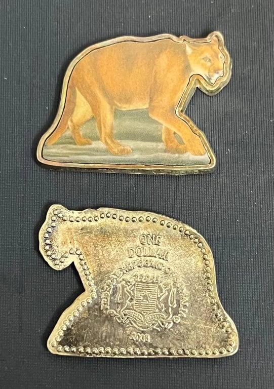 SOMALIA COUGAR SHAPED COLORED COIN USED